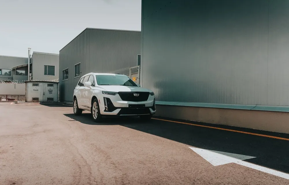 Cadillac XT crossover beside a building
