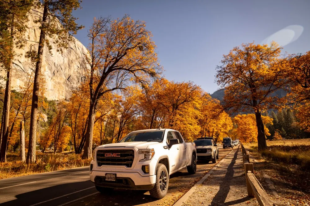 GMC Sierra 1500 on an autumn road