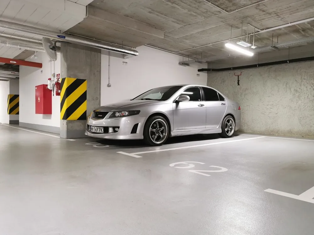 Honda sedan in a parking garage