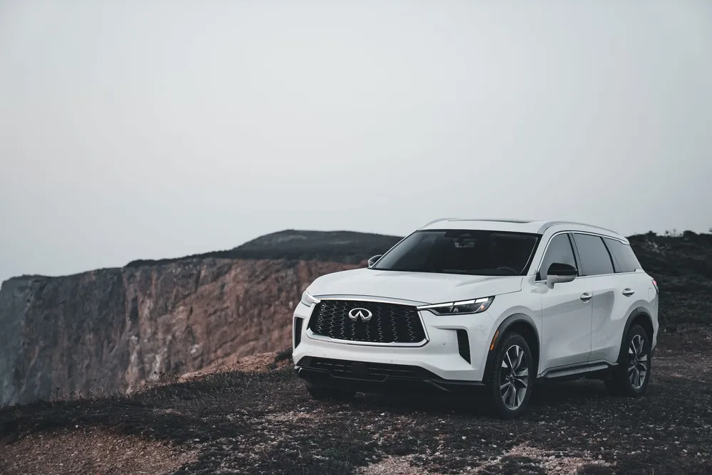 Infiniti QX60 on a coastal road