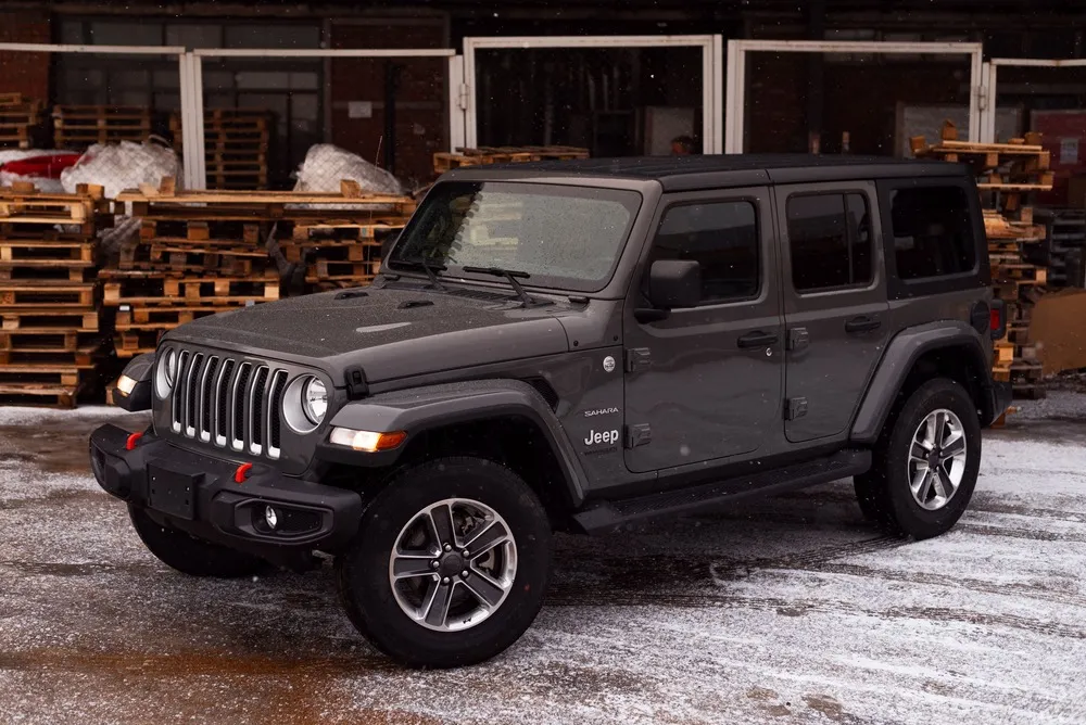 Jeep Wrangler in front of pallets