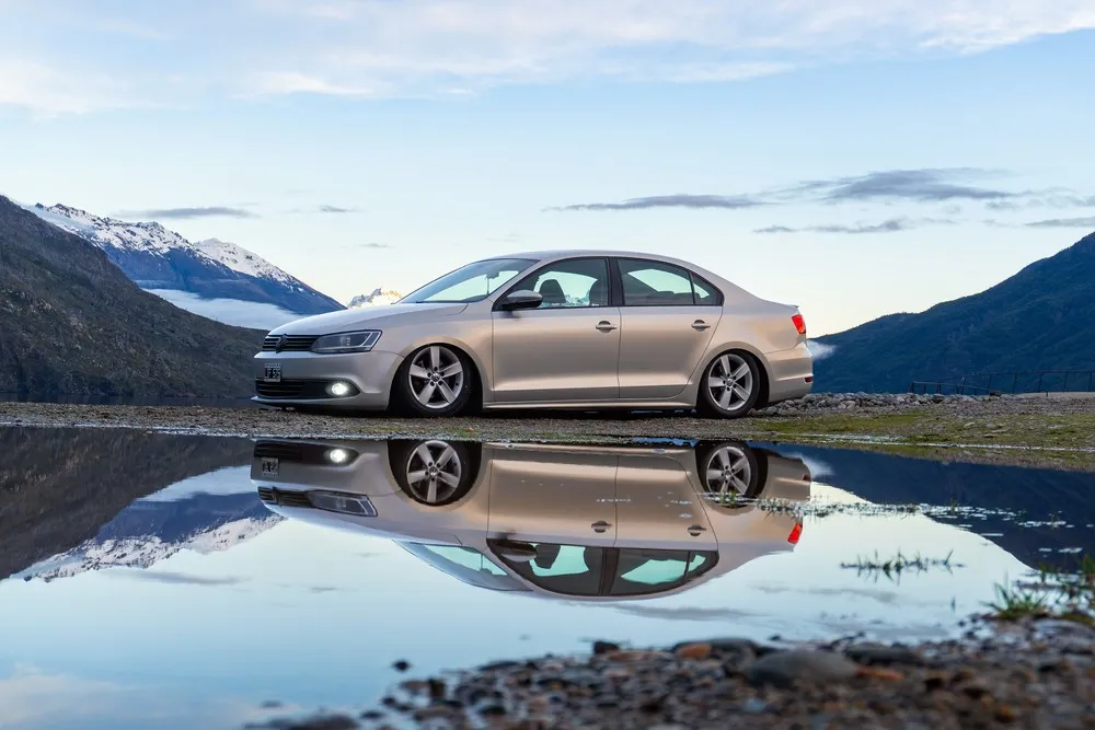 Volkswagen sedan by a lake