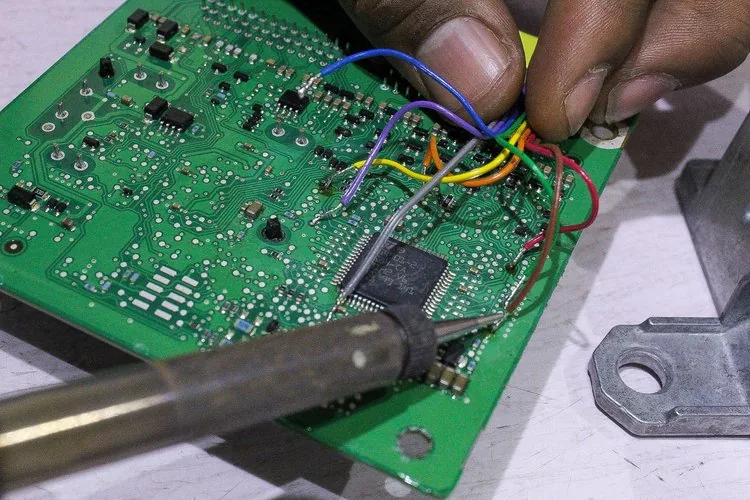 Resetting an airbag control module in our shop at Five Star Airbags