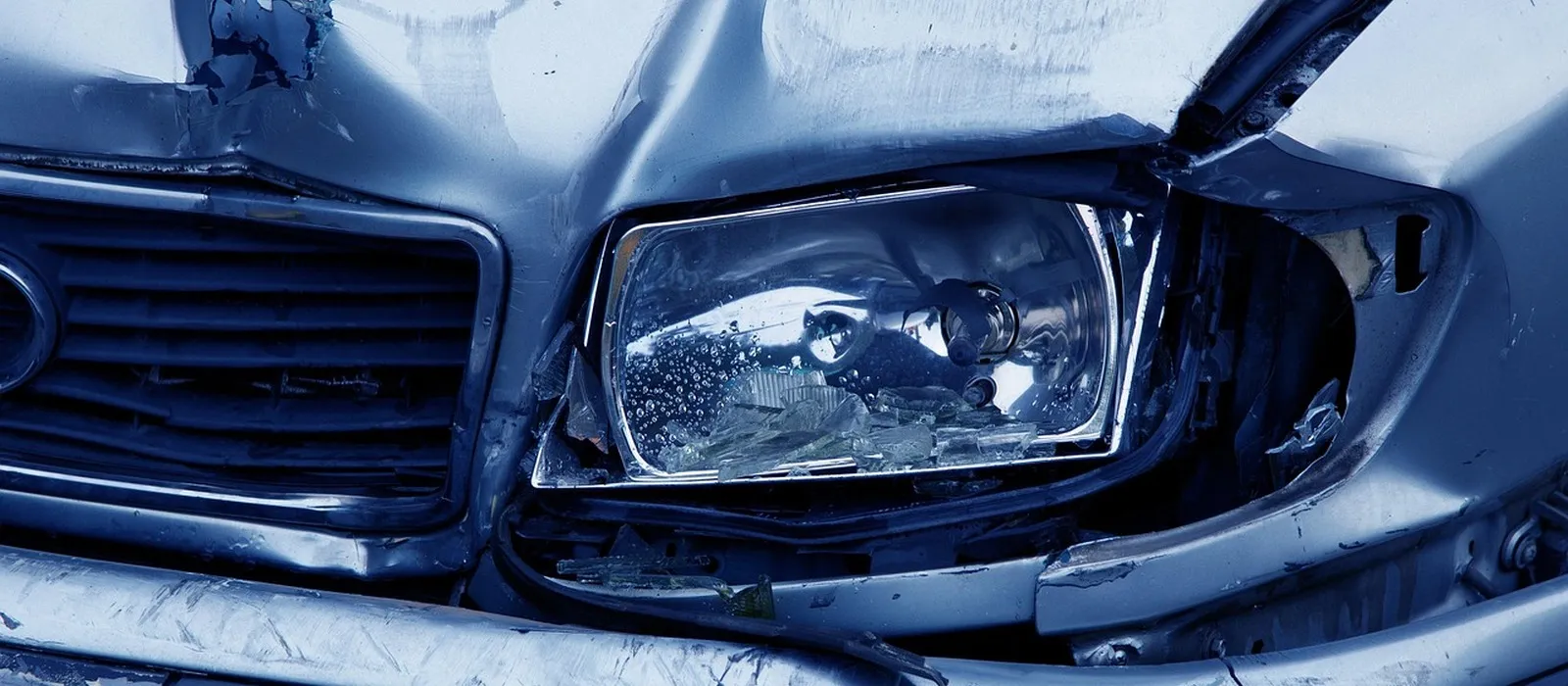 Front-end collision damage on a passenger car