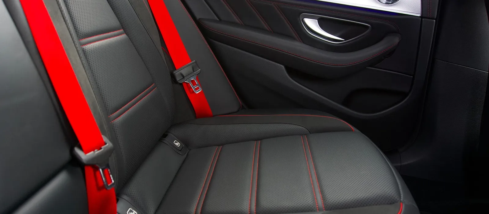 Red seat belts on the rear seat of a modern car