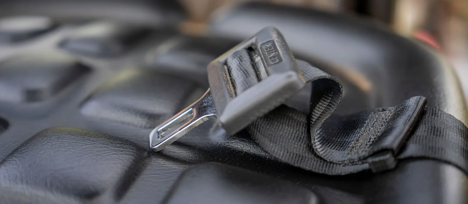 Seat belt latch plate and buckle on a car seat